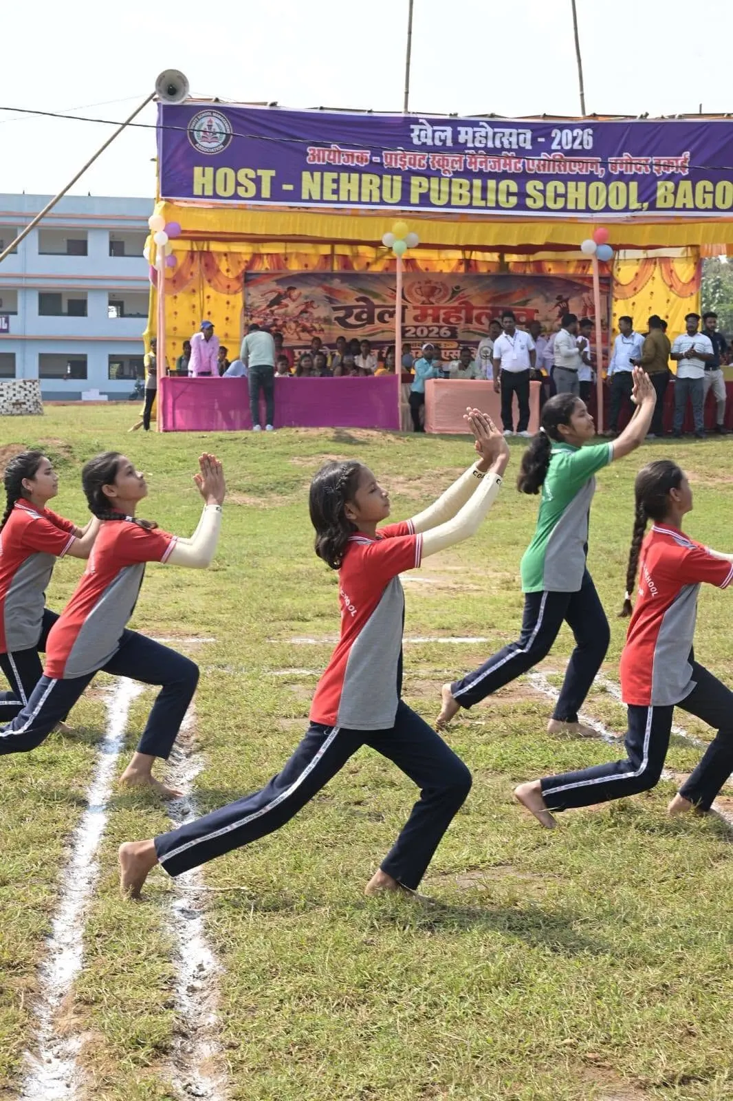 Girls in a Kho-Kho chase in front of the Khel Mahotsav stage