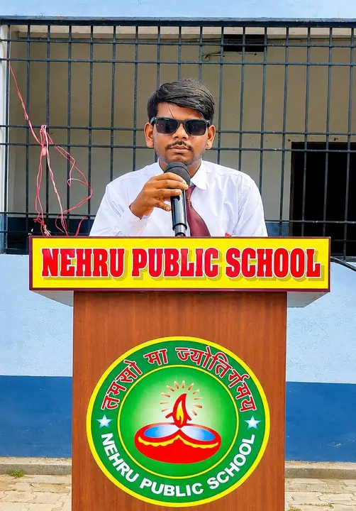 A student speaks from the school podium on Independence Day