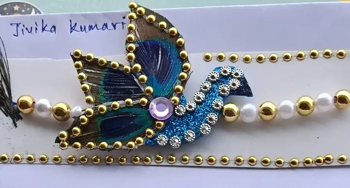 A handmade peacock rakhi
